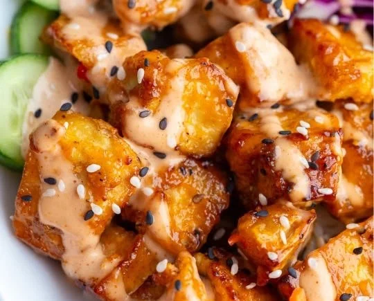 Crispy Air Fryer Bang Bang Tofu served in a bowl with sauce and vegetables