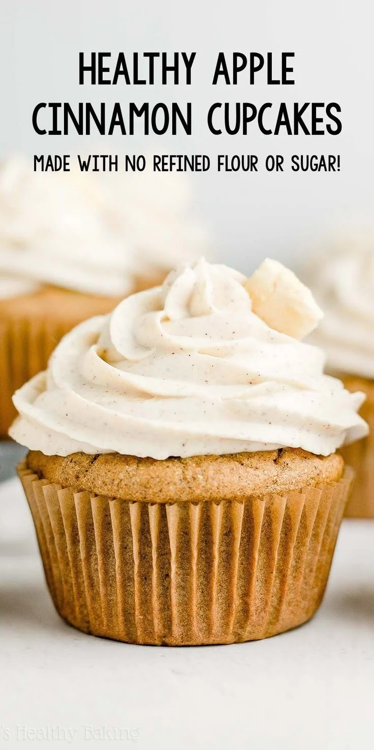 Healthy cinnamon apple cupcakes topped with fresh apple slices and cinnamon sprinkles.