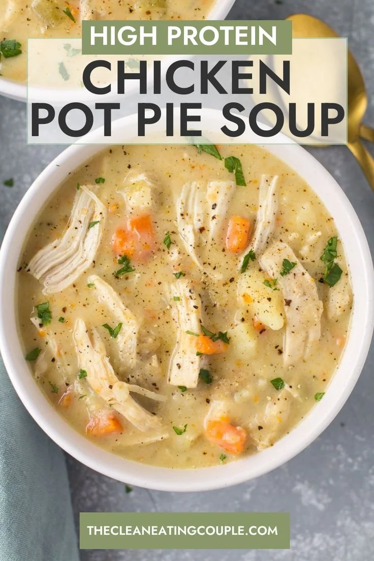 A bowl of high protein chicken pot pie soup garnished with herbs
