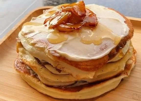 Low calorie protein pancakes stacked on a plate with fresh berries