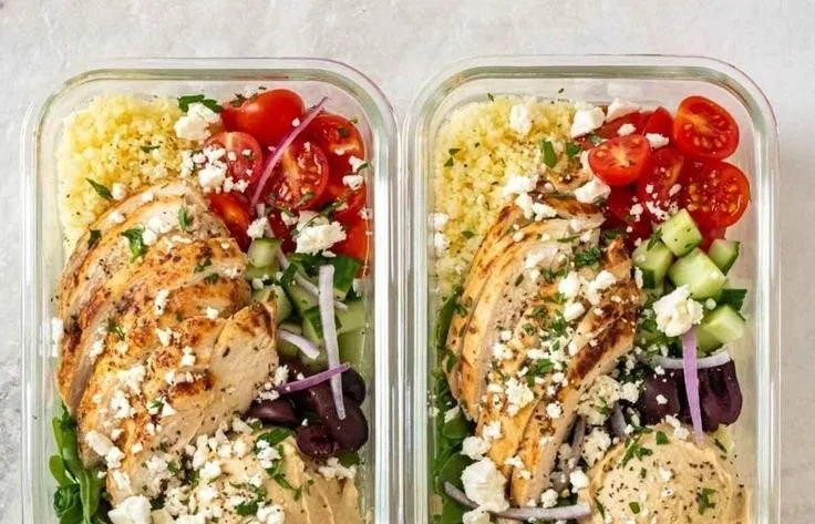 Colorful Mediterranean meal prep bowls with fresh veggies, proteins, and grains.