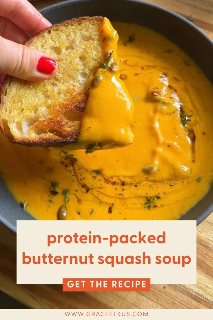 Delicious bowl of protein-packed butternut squash soup topped with herbs.