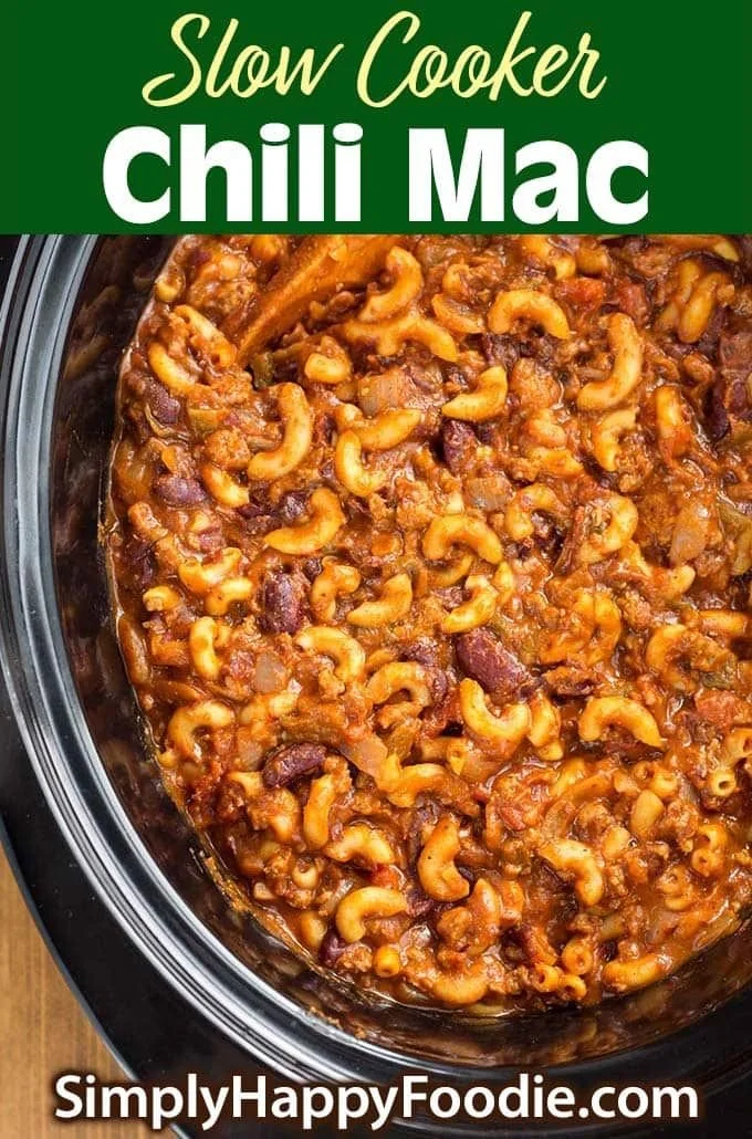 Delicious slow cooker chili mac served in a bowl with cheese and toppings.