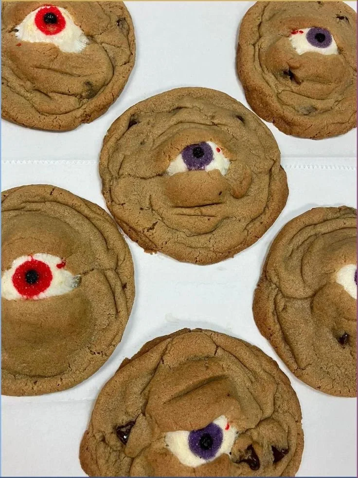 Spooky Halloween cookies decorated with ghosts, pumpkins, and witches