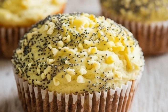 Delicious zesty lemon poppy seed muffins with cottage cheese on a wooden table